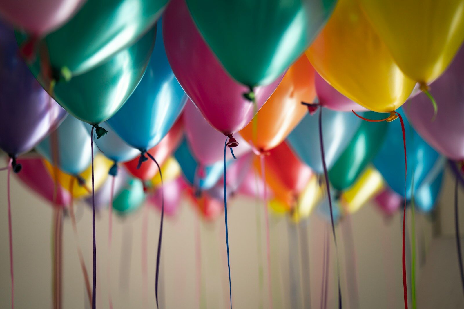 Photo by Adi Goldstein selective focus photography of assorted-color balloons
